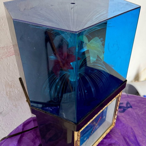 Vintage clock with optical fibers and rotating flower used