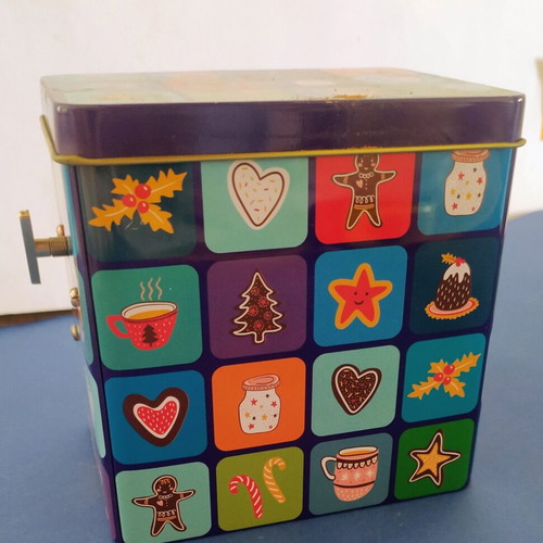 Christmas music box with winding key and festive designs