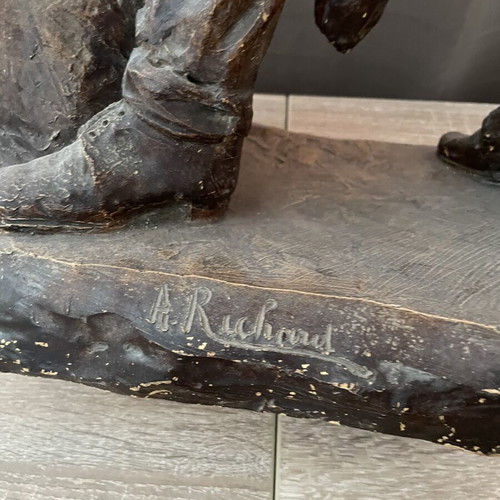 Old ceramic figurine with artist signature, possibly German