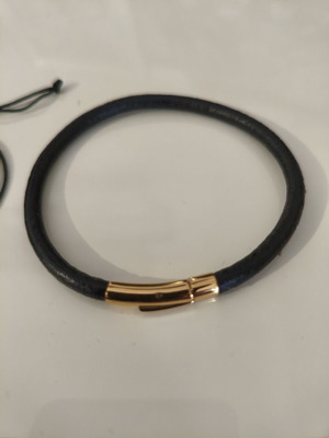 Unisex minimalist black bracelets set used, metal alloy with gold details
