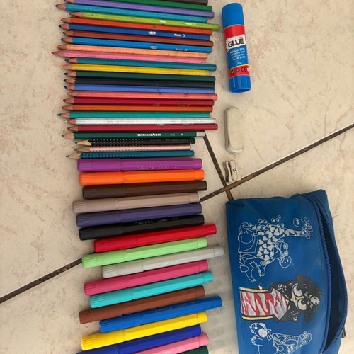 Blue school pencil case with markers and colored pencils
