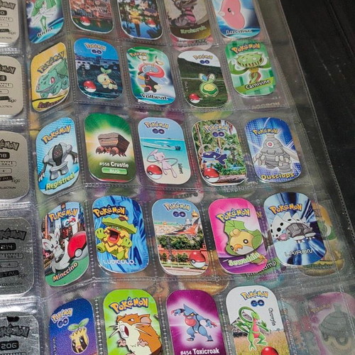 Pokemon GO The Original Metal Tags Album like new with 270 metal tags