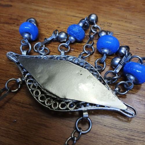 Vintage metal evil eye decoration used, silver with blue beads