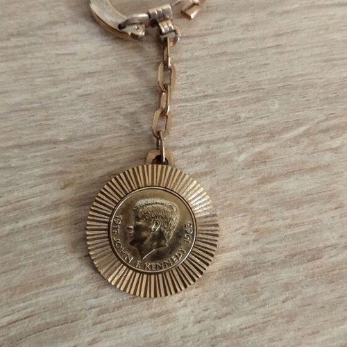 Kennedy keychain used, gold color