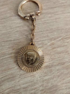 Kennedy keychain used, gold color