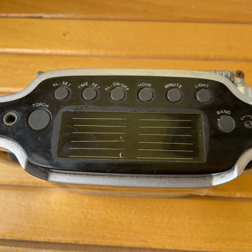 Power Plus solar transistor radio used with clock and flashlight