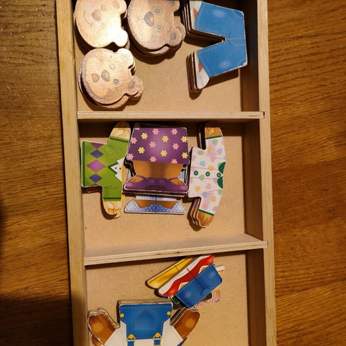 Melissa and Doug wooden puzzle like new with 3 figures and clothes