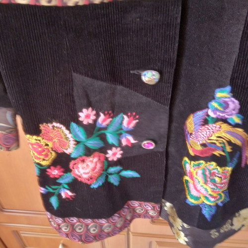 Black corduroy/velvet coat like new, size L/XL with colorful designs