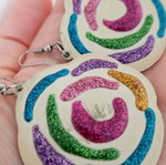 Plastic earrings used with glitter
