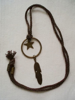 Handmade Boho necklace with brown cord and metal pendant