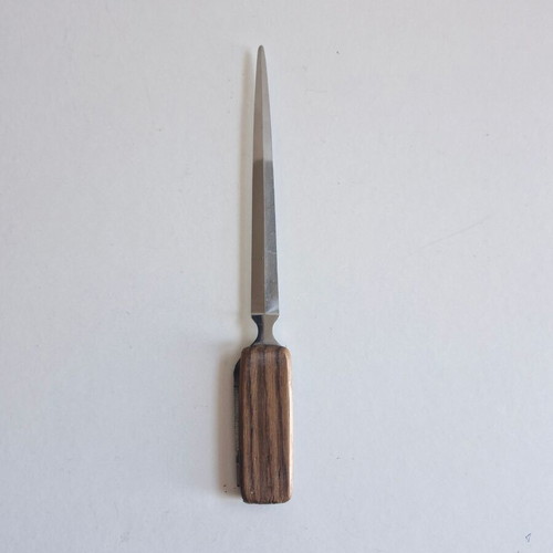 Paper cutter with built-in knife used