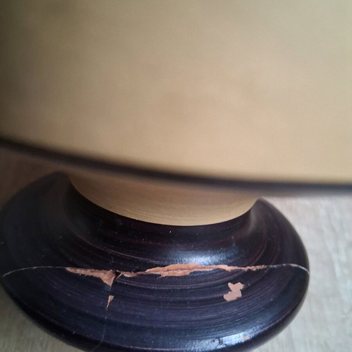 Clay vase used with repaired neck