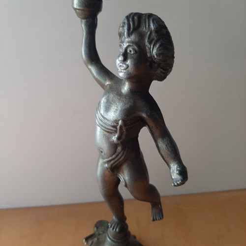 Vintage metal candlestick with boy figure like new
