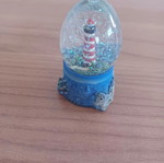 Ceramic lighthouse snow globe decorative item like new