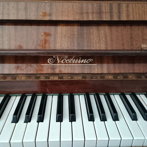 Noctuino upright piano like new, walnut wood finish
