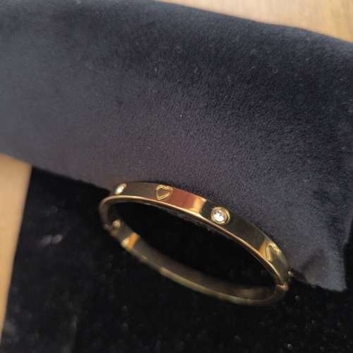 Gold Tone Bangle Bracelet with Hearts and Crystal Details new