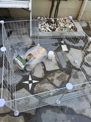 Rabbit cage and enclosure with food, bedding, and accessories used