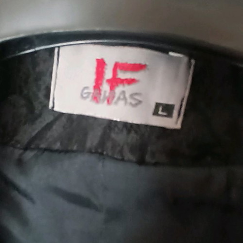 Black jacket used with shiny fabric