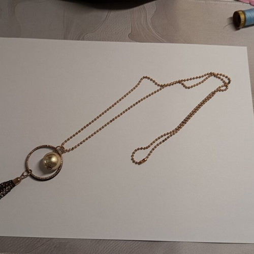 Long statement necklace like new, black and gold tassel pendant