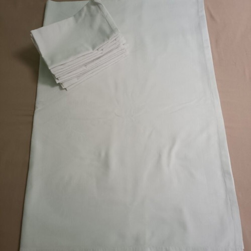 White tablecloth set with 12 used embossed napkins