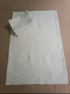 White tablecloth set with 12 used embossed napkins