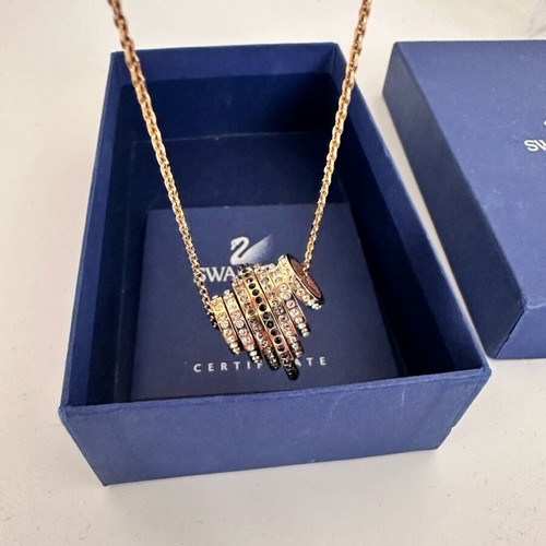 Swarovski Further necklace like new, gold tone with black and clear crystals