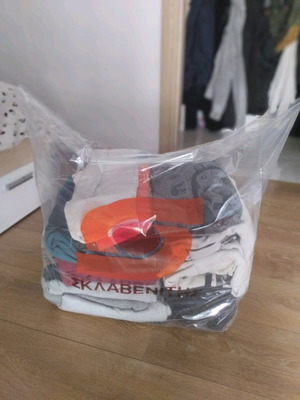 a bag full of men's branded clothes aged 10 to 13-14