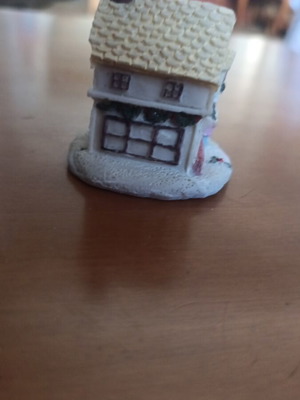 Small clay house like new with detailed Christmas decoration