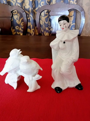 Porcelain figurine set like new with sad boy and bird couple