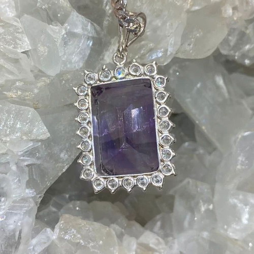 Silver pendant with large cut natural amethyst stone and moissanites