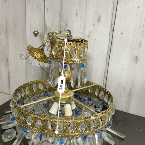 Vintage gold chandelier used with crystals and blue details