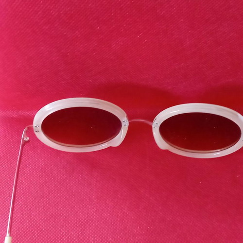 Sunglasses used, beige color