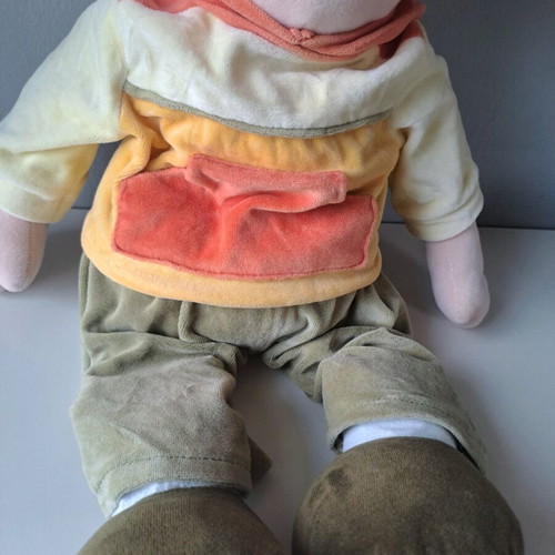 Cloth doll with hat and orange details like new