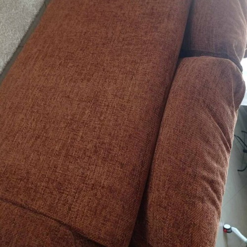Two-seater sofa used, warm brown color, removable cushion covers