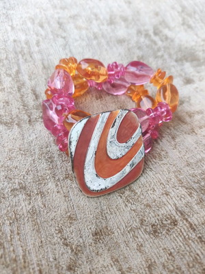 Vintage bracelet used with orange and pink beads