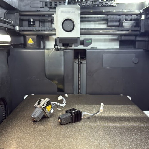 Bambu Lab X1C 3D printer with complete hotends and PEI texture plate