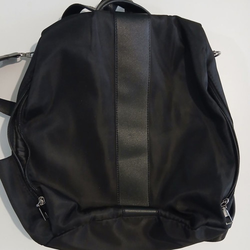 Black backpack with rear compartment opening