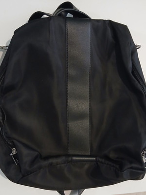 Black backpack with rear compartment opening