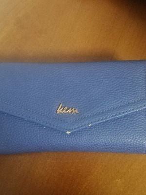 KEM wallet used, blue with multiple compartments