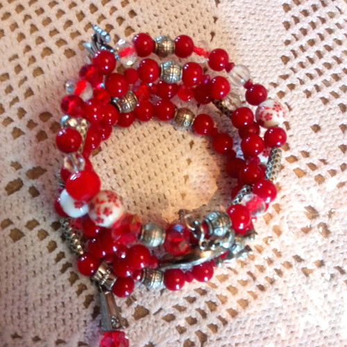 Handmade bracelet with red beads and multiple strands, new
