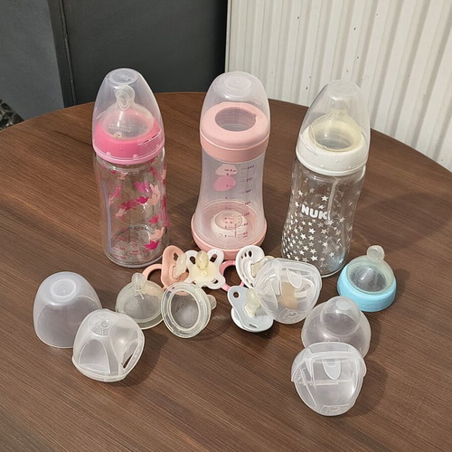 Baby bottles and pacifiers used set