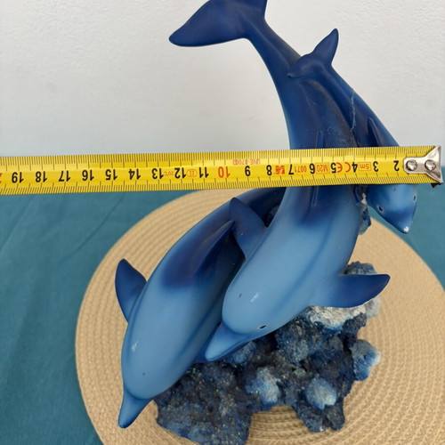 Decorative dolphins refurbished with damage