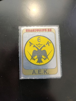 Panini Football 83 silver AEK emblem sticker #1
