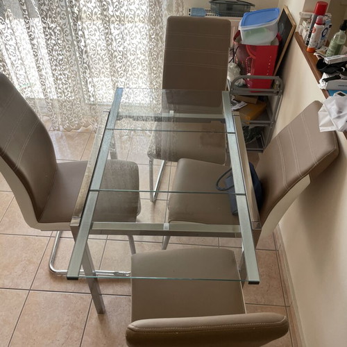 Glass dining table with 4 chairs used, extendable, beige leatherette