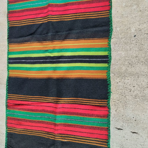 Woven loom runner used with green trim