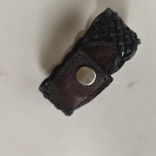 Leather bracelet used, black with brown details, sturdy weave