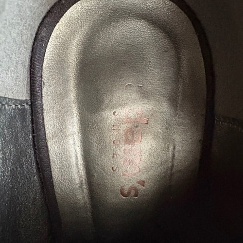 Adam’s black high-heeled shoes like new