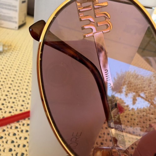 Miu Miu SMU 54ZS ZVN-70D sunglasses like new, gold frame, pink lenses