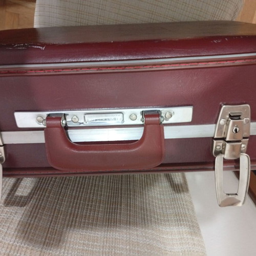 Vintage travel suitcase used, burgundy leather exterior