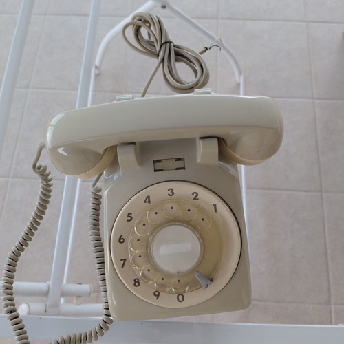 Two OTE wired telephones, beige